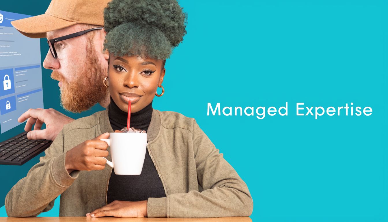 A woman with green hair drinking coffee while a man uses a computer for IT security.