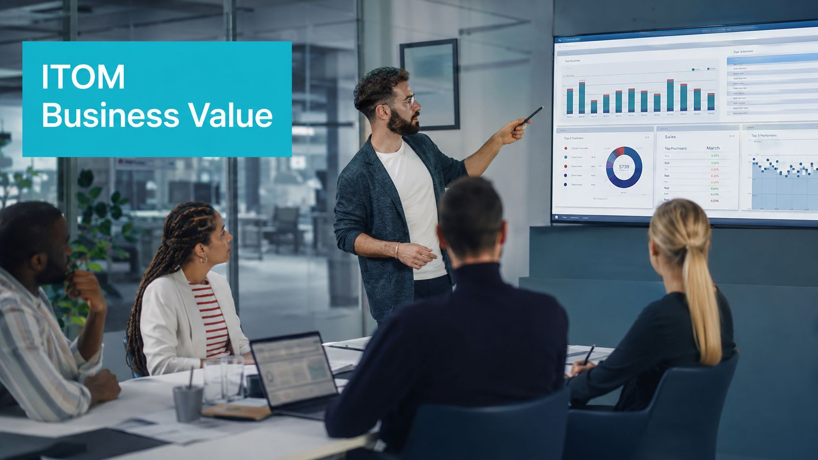 A professional man presents ITOM business value data on a large screen to his office team.